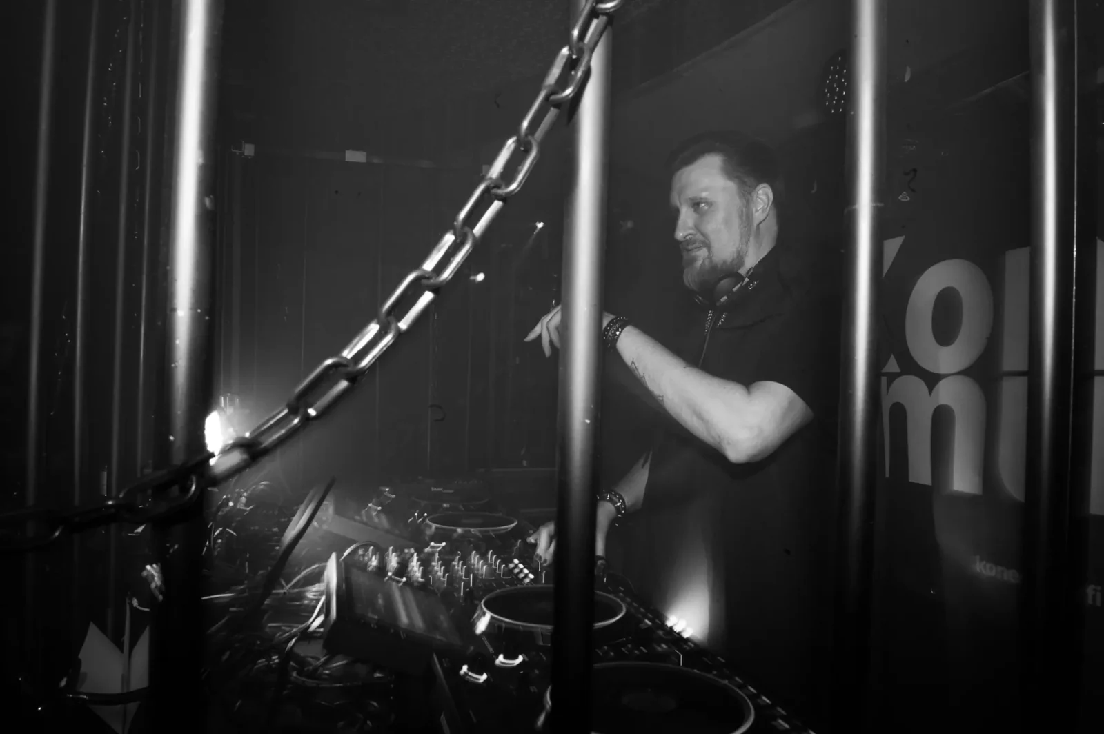 Mytke performing behind a DJ setup